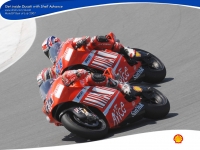 Кейси Стоунер и Лорис Капиросси - Marlboro Ducati - Powered by SHELL Advance 1024x768